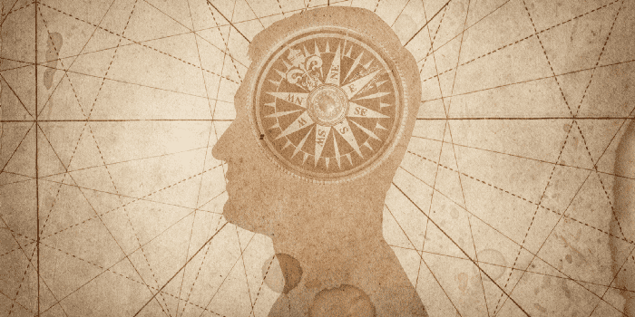 Image of a compass superimposed over a silhouette of a man
